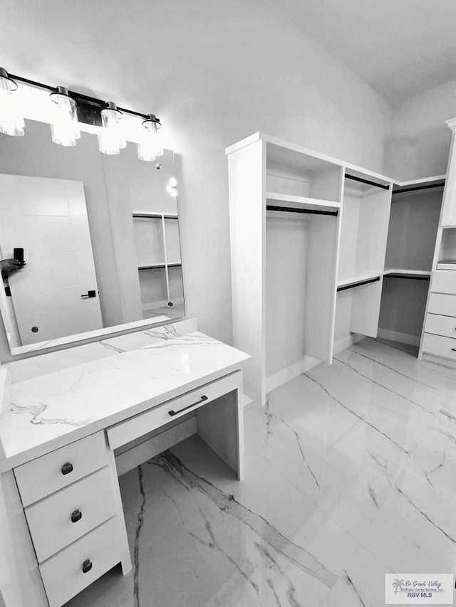 115 Finch Dr, Los Fresnos, TX 78566 - full bath with vanity, a spacious closet, and marble finish floors