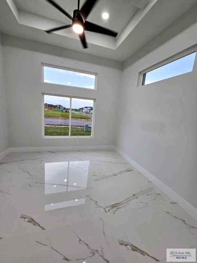 115 Finch Dr, Los Fresnos, TX 78566 - empty room featuring marble finish flooring and ceiling fan
