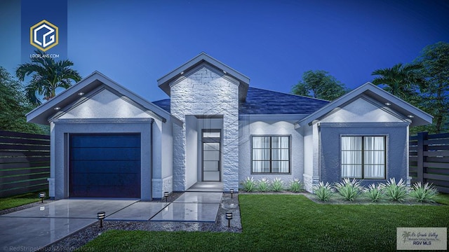 view of front of home featuring a front lawn and a garage