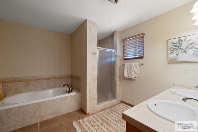 1675 Chipinque Dr, Brownsville, TX 78526 - bathroom featuring tile patterned flooring, a bath, a stall shower, and double vanity