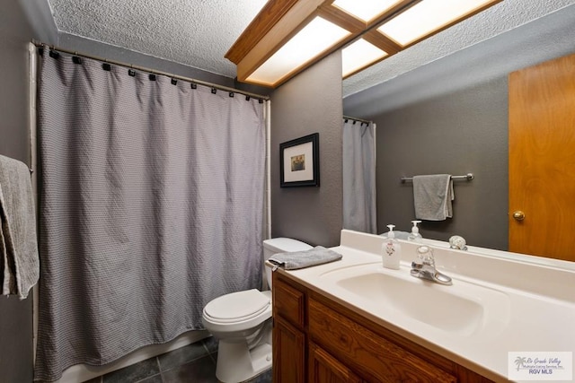 1675 Chipinque Dr, Brownsville, TX 78526 - bathroom with toilet, vanity, tile patterned floors, and a textured ceiling