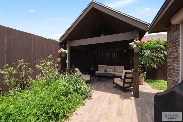 1675 Chipinque Dr, Brownsville, TX 78526 - view of patio / terrace with outdoor lounge area, fence, and a deck