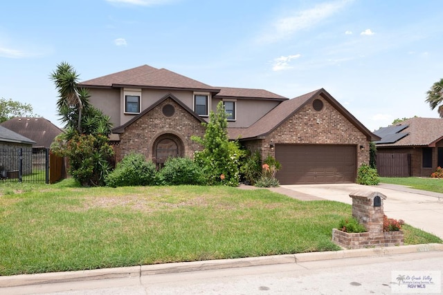 1675 Chipinque Dr, Brownsville, TX 78526 - view of front facade featuring stucco siding, concrete driveway, a garage, brick siding, and a shingled roof