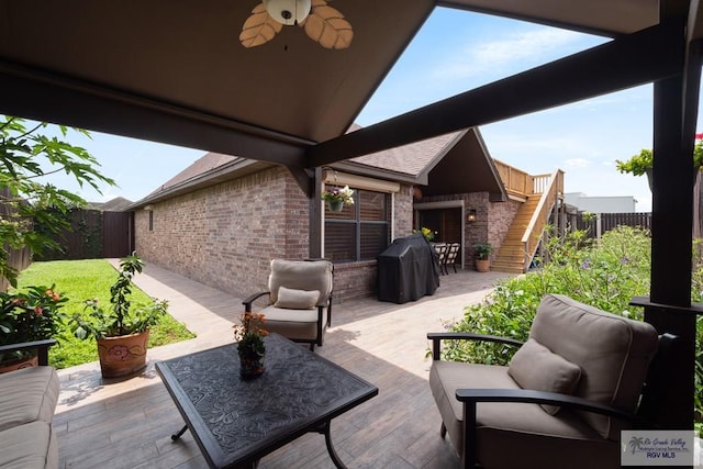 1675 Chipinque Dr, Brownsville, TX 78526 - view of patio / terrace with stairway, a fenced backyard, a ceiling fan, area for grilling, and a wooden deck