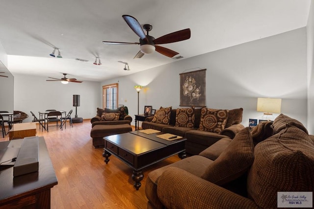 1675 Chipinque Dr, Brownsville, TX 78526 - living area with ceiling fan, wood finished floors, and track lighting