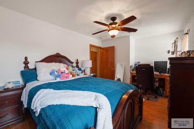 1675 Chipinque Dr, Brownsville, TX 78526 - bedroom featuring wood finished floors, a desk, and ceiling fan