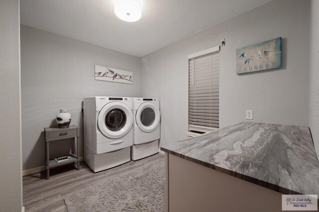 1675 Chipinque Dr, Brownsville, TX 78526 - laundry room featuring separate washer and dryer and light wood-style flooring