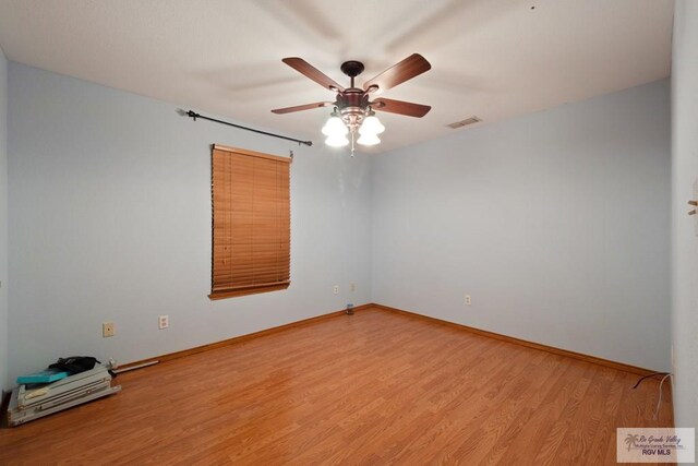 1675 Chipinque Dr, Brownsville, TX 78526 - unfurnished room with a ceiling fan, light wood-style flooring, and baseboards