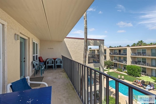 116 E Polaris Dr Unit 305, South Padre Island, TX 78597 - balcony featuring view of pool area