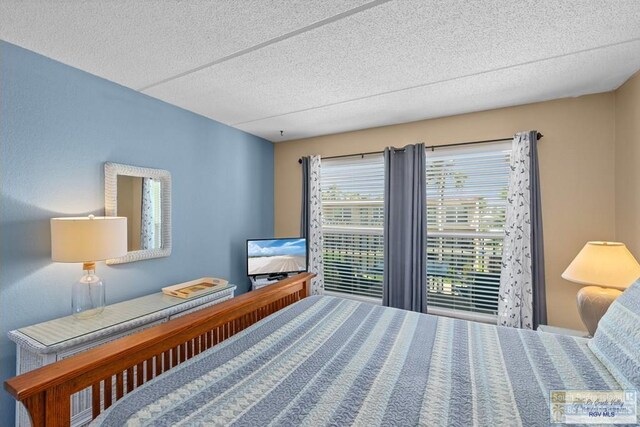 116 E Polaris Dr Unit 305, South Padre Island, TX 78597 - bedroom featuring a textured ceiling