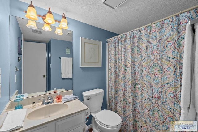 116 E Polaris Dr Unit 305, South Padre Island, TX 78597 - bathroom with vanity, a textured ceiling, and a shower with curtain