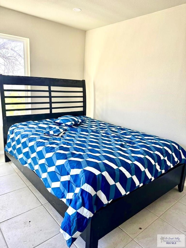 bedroom featuring tile patterned floors