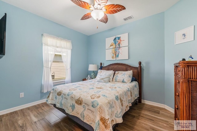 bedroom featuring hardwood / wood-style floors and ceiling fan