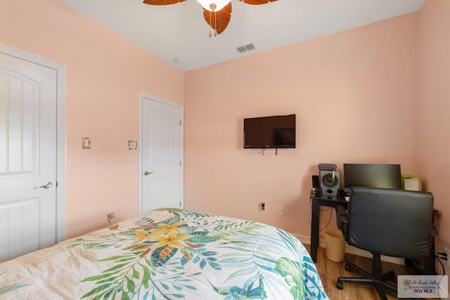 bedroom featuring hardwood / wood-style flooring and ceiling fan