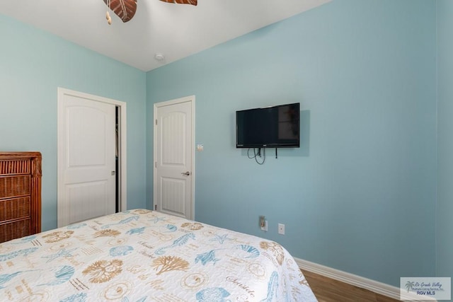 bedroom featuring ceiling fan and hardwood / wood-style flooring