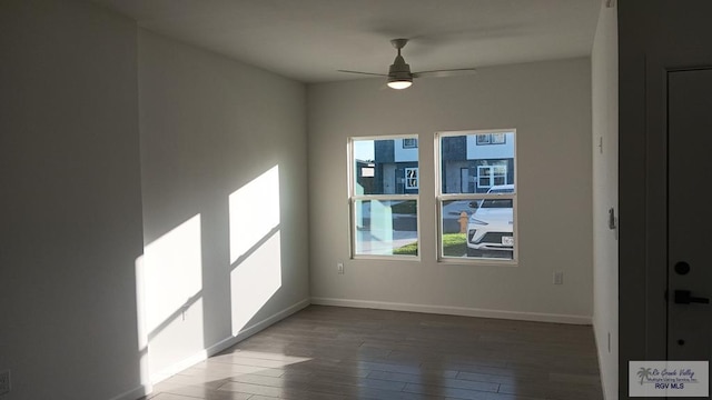 empty room featuring hardwood / wood-style floors and ceiling fan