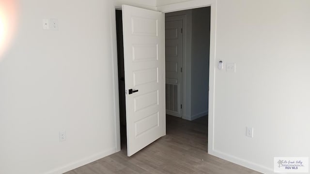 spare room with light hardwood / wood-style floors