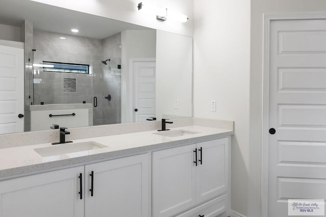 bathroom featuring vanity and walk in shower