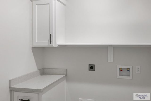 laundry area with cabinets, washer hookup, and electric dryer hookup