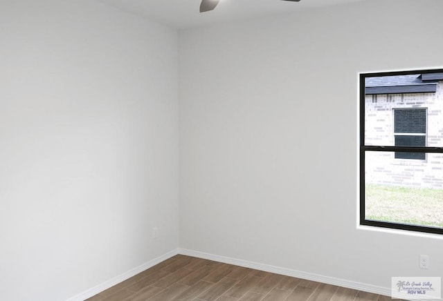 empty room featuring hardwood / wood-style floors and ceiling fan