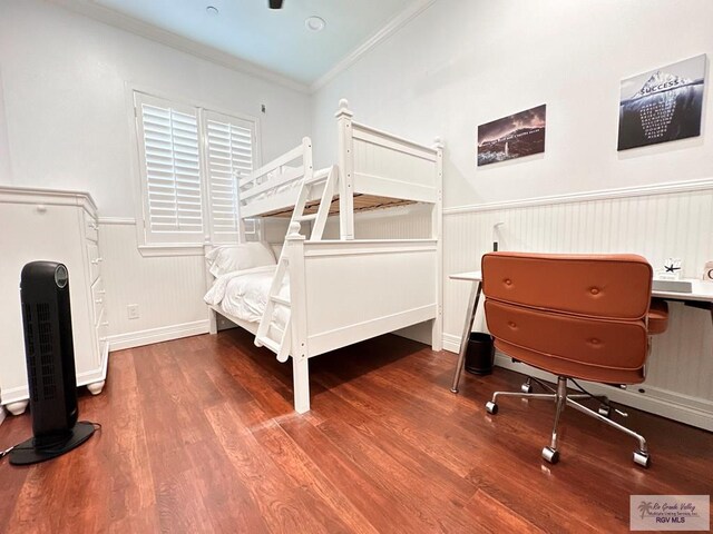 107 E Palm St Unit B, South Padre Island, TX 78597 - bedroom with a wainscoted wall, wood finished floors, and ornamental molding