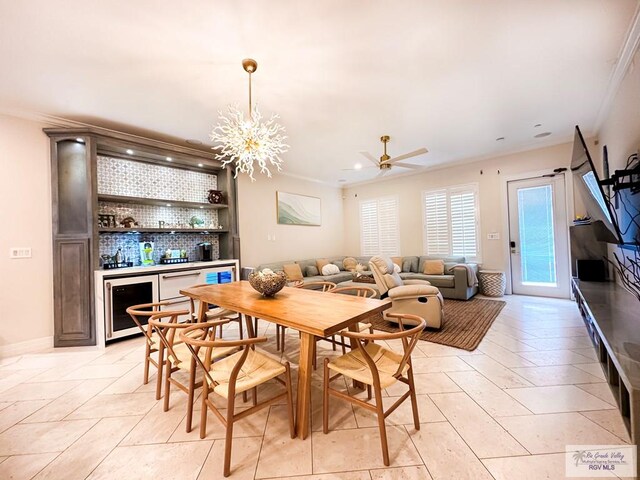 107 E Palm St Unit B, South Padre Island, TX 78597 - dining area with wine cooler, bar area, a ceiling fan, recessed lighting, and ornamental molding