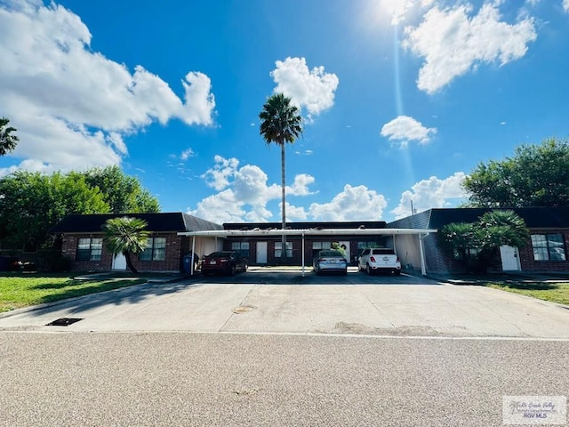 view of front of home featuring a carport