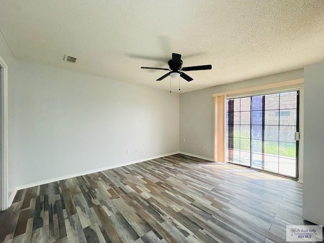 unfurnished room with wood-type flooring, a textured ceiling, and ceiling fan