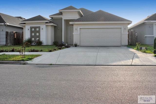 3512 Westcreek Dr, Brownsville, TX 78526 - view of front facade featuring a garage, driveway, stucco siding, and roof with shingles