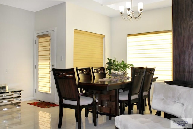3512 Westcreek Dr, Brownsville, TX 78526 - dining area featuring a chandelier and baseboards