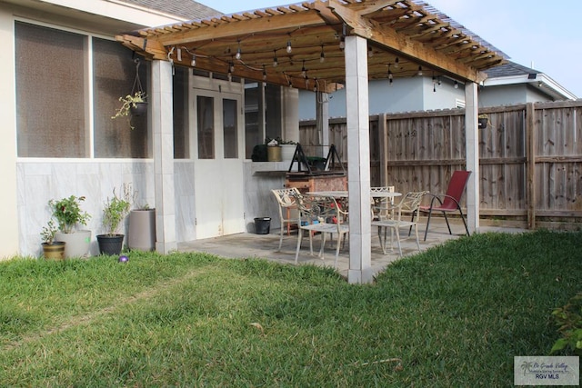 view of patio featuring fence