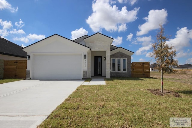 view of front of house with a garage and a front yard