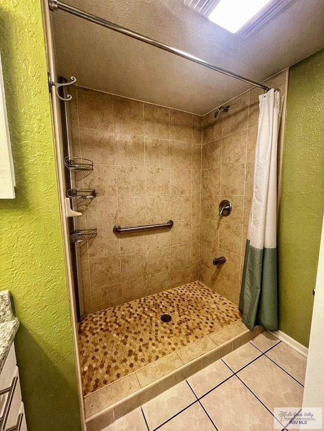 bathroom featuring tile patterned flooring and a shower with curtain