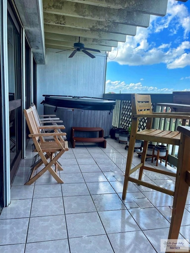 balcony featuring ceiling fan and a hot tub