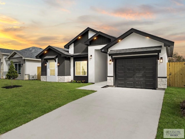 view of front of house with a lawn and a garage