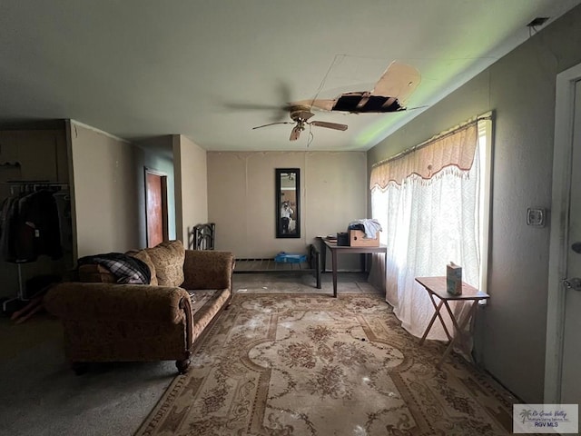 interior space with carpet and ceiling fan