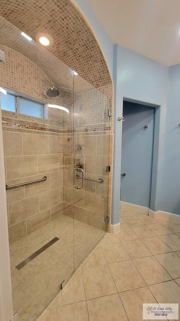 3429 E Country Club Dr, Edinburg, TX 78542 - full bath featuring baseboards, tile patterned floors, and a stall shower