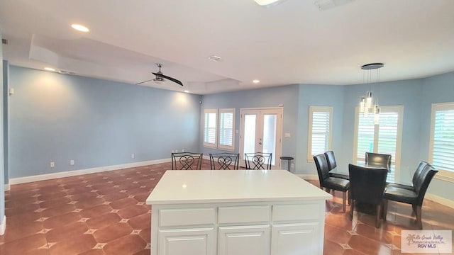 3429 E Country Club Dr, Edinburg, TX 78542 - kitchen featuring baseboards, recessed lighting, white cabinetry, pendant lighting, and ceiling fan