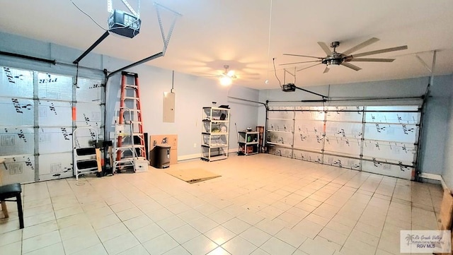 3429 E Country Club Dr, Edinburg, TX 78542 - garage with electric panel, a ceiling fan, baseboards, and a garage door opener