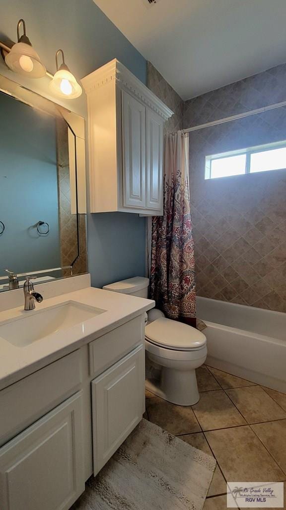 3429 E Country Club Dr, Edinburg, TX 78542 - bathroom with shower / tub combo, toilet, vanity, and tile patterned floors