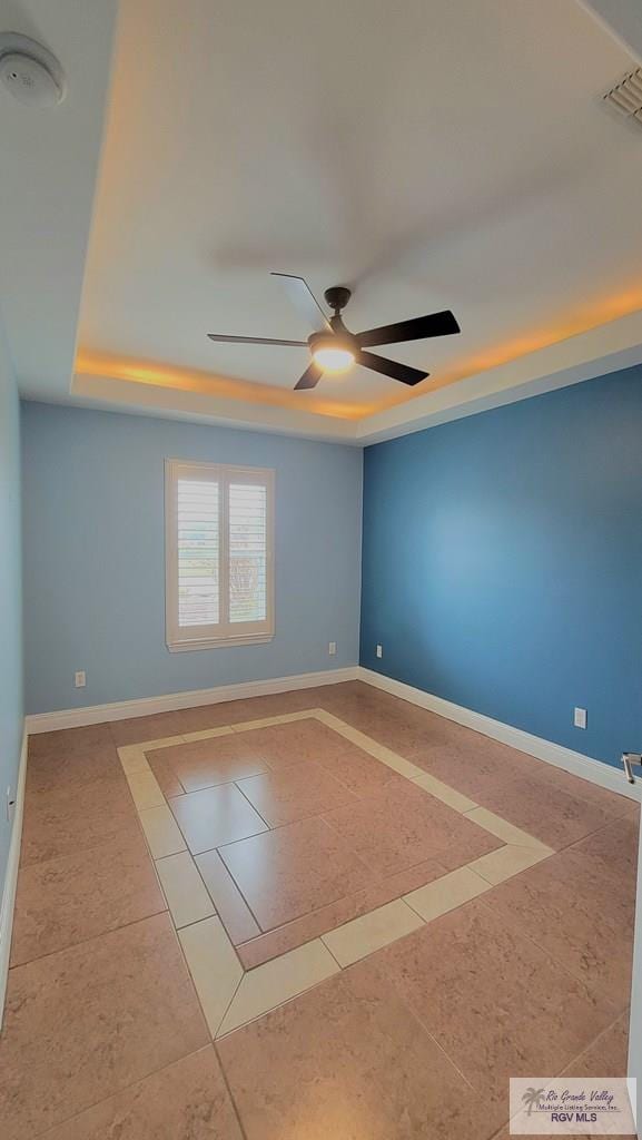 3429 E Country Club Dr, Edinburg, TX 78542 - spare room with visible vents, tile patterned flooring, baseboards, and ceiling fan