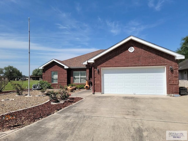 3429 E Country Club Dr, Edinburg, TX 78542 - ranch-style house featuring brick siding, driveway, and a garage