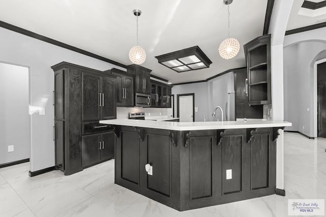 6948 Wild Olive Ln, Brownsville, TX 78526 - kitchen with crown molding, pendant lighting, stainless steel appliances, and sink