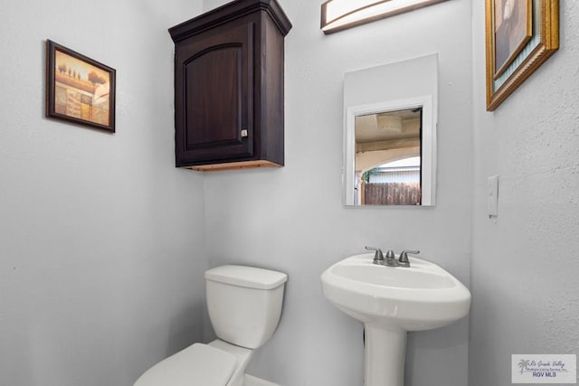 6948 Wild Olive Ln, Brownsville, TX 78526 - bathroom with toilet