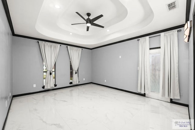 6948 Wild Olive Ln, Brownsville, TX 78526 - unfurnished room with a tray ceiling, ceiling fan, and crown molding