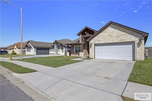 view of front of house featuring a front yard and a garage