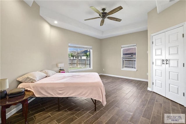 bedroom featuring ceiling fan and a closet