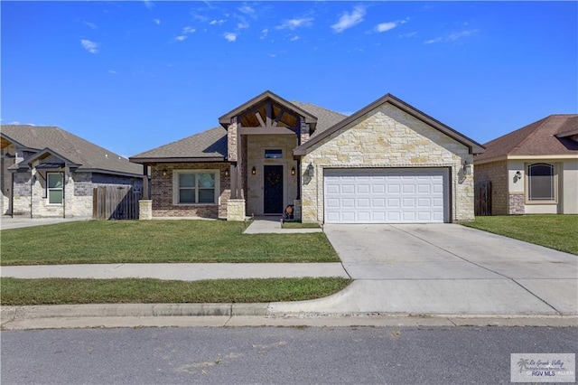 view of front of home featuring a front lawn and a garage