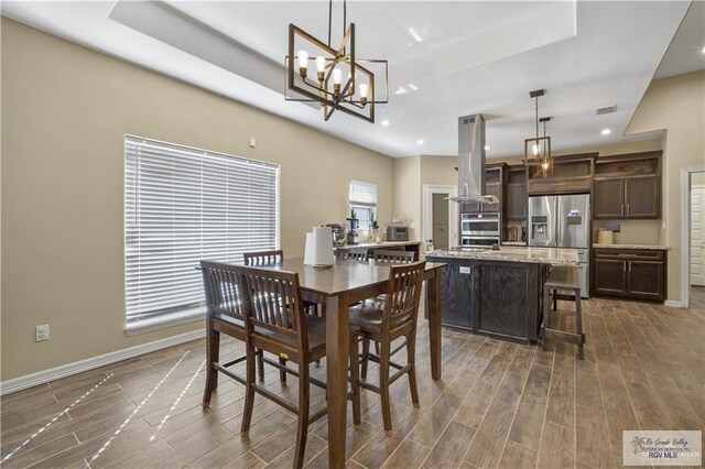 dining space featuring an inviting chandelier