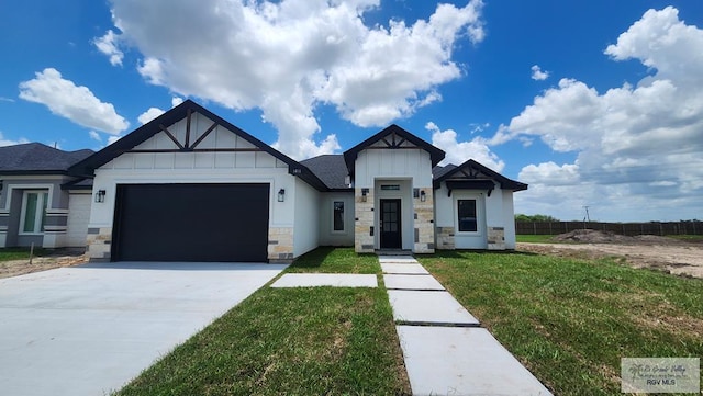 1418 Stirrup Cir, San Benito, TX 78586 - view of front of property with driveway, board and batten siding, an attached garage, and stone siding